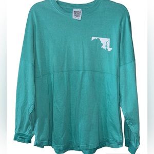 Royce Brand long sleeve Maryland shirt with thumb holes on the sleeves.